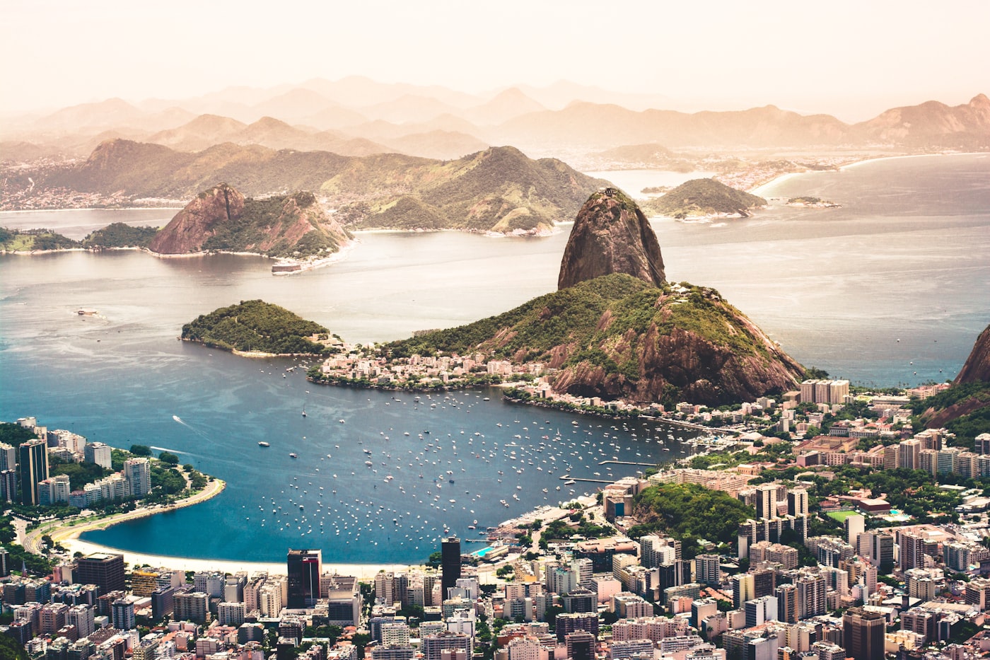 The iconic Christ the Redeemer statue looking over the beaches and mountains of Rio de Janeiro