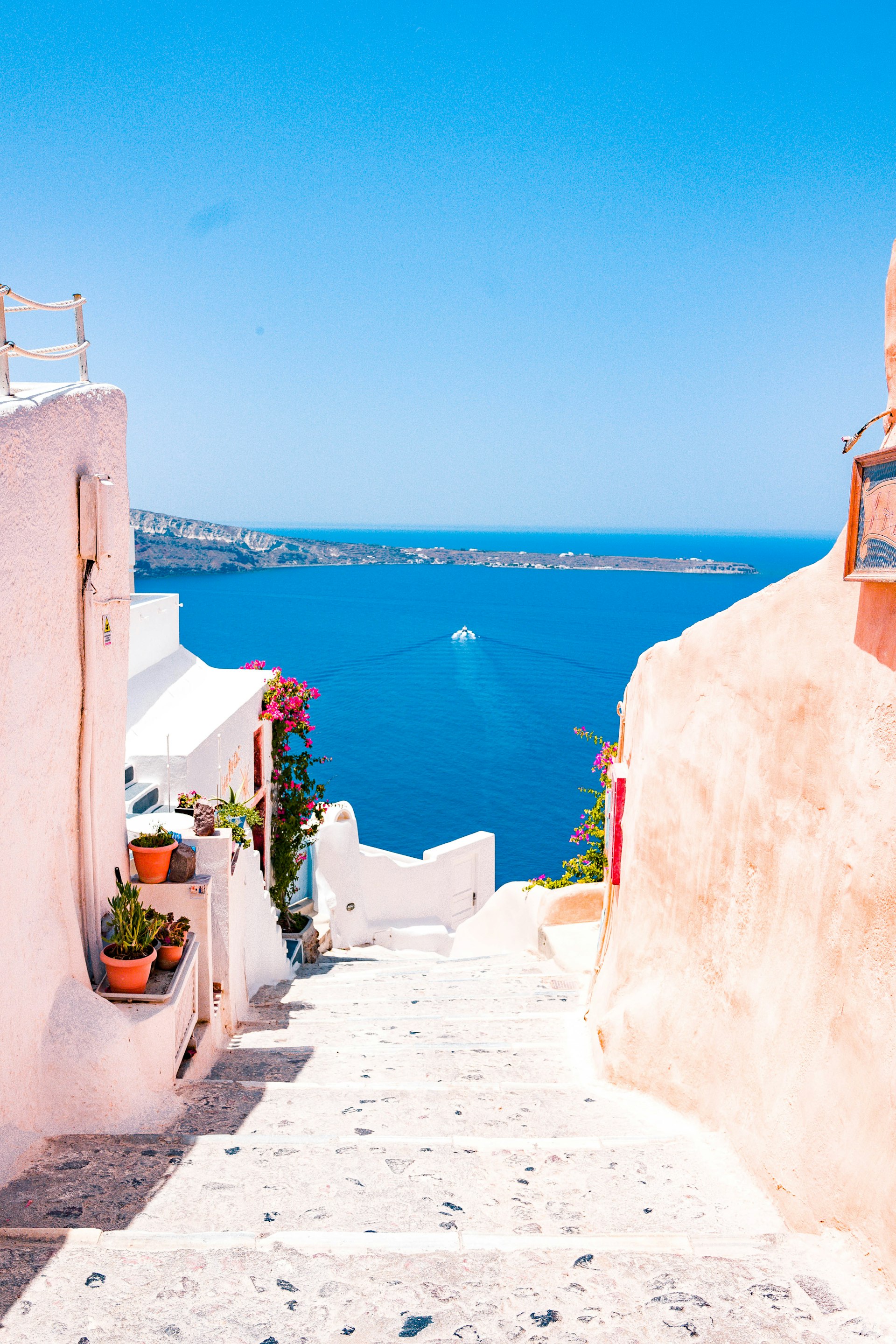 Santorini white buildings with blue domes overlooking the sea