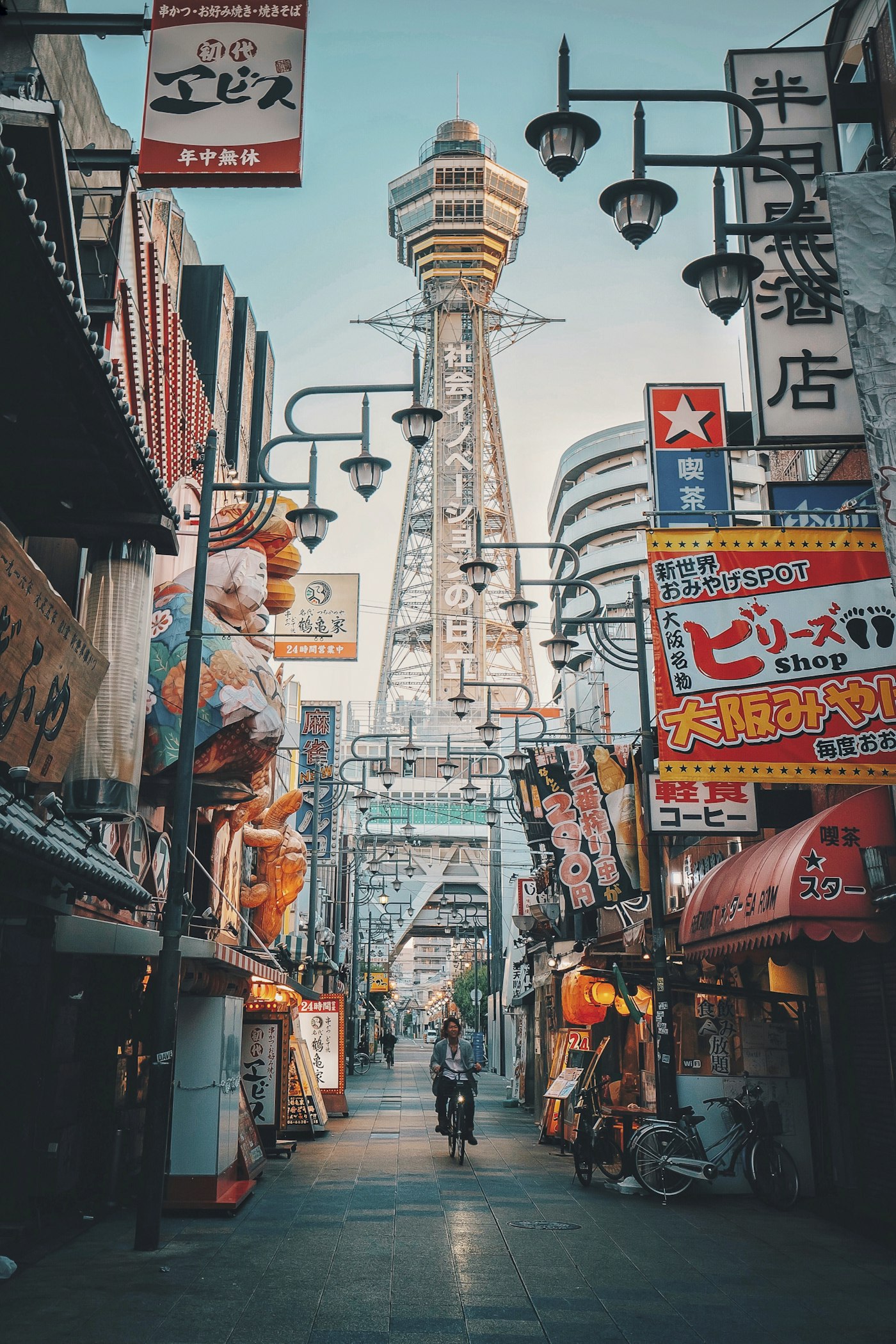 The vibrant neon signs lining the Dotonbori canal at night, reflecting in the water