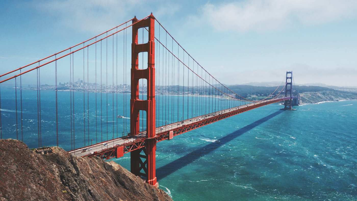 The Golden Gate Bridge emerging from thick morning fog in San Francisco