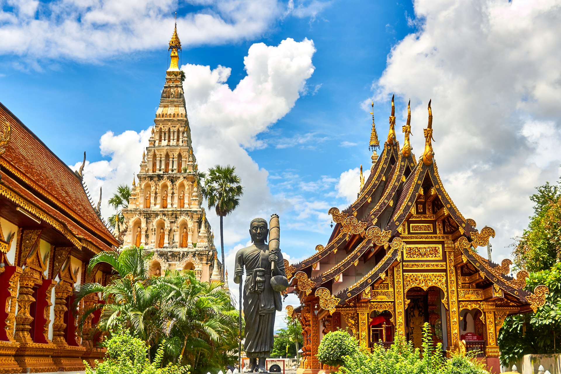 Thai temple with golden spires at sunset